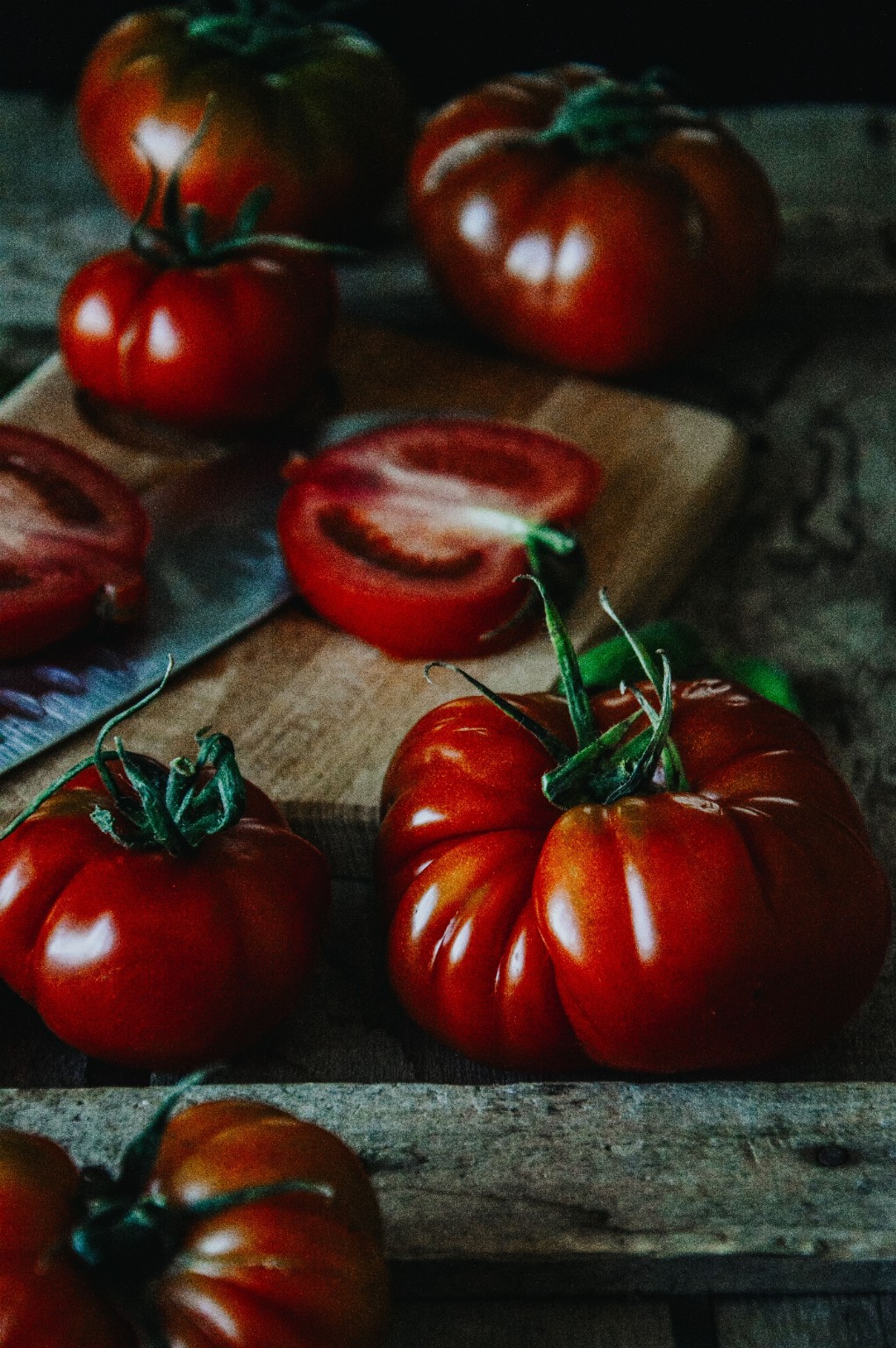 Fresh tomatoes on a wooden board